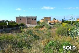 Building plot with construction project and partial sea views