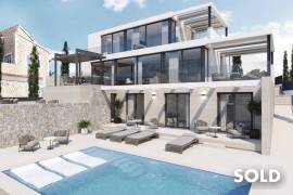 Building plot with construction project and partial sea views